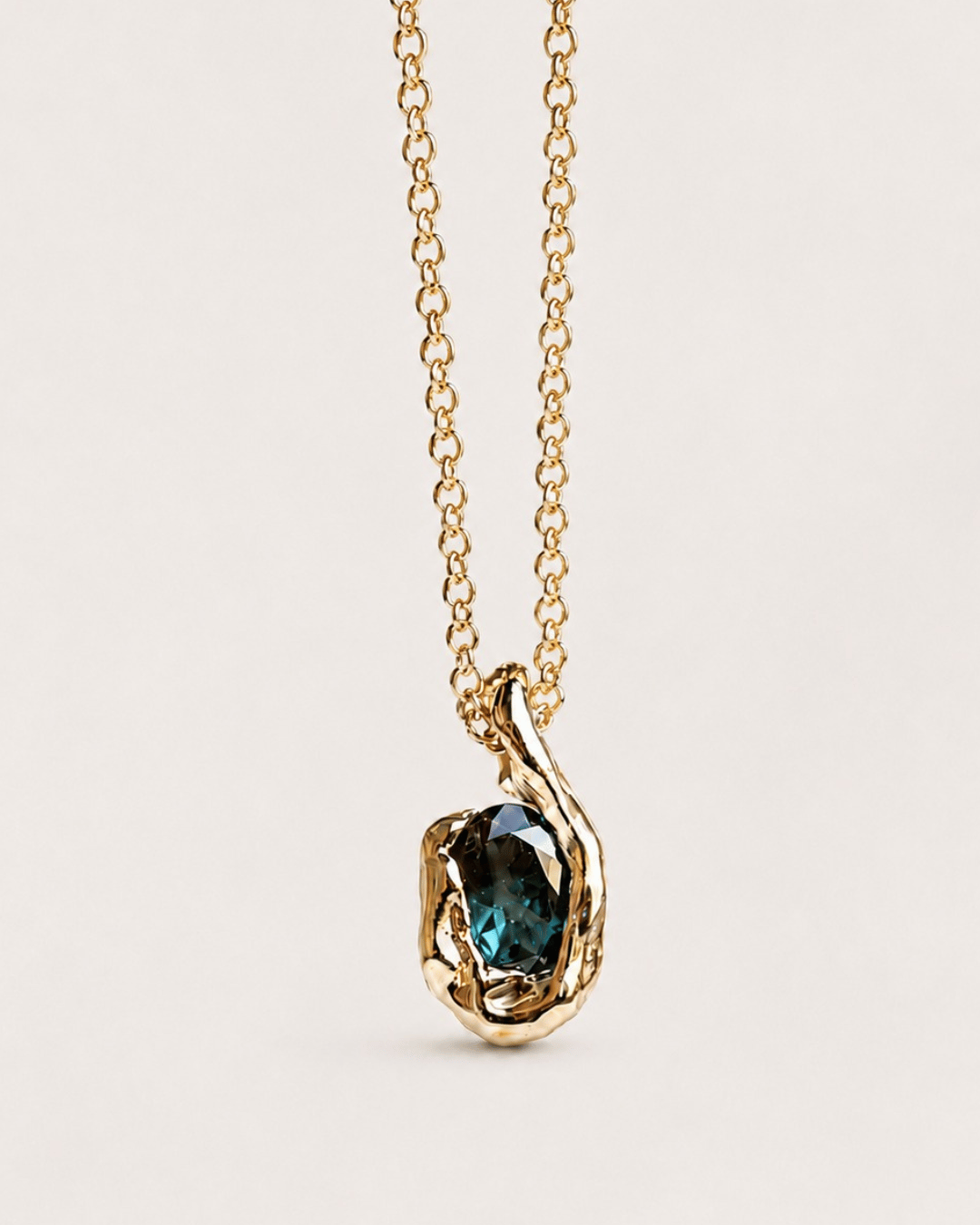 Beryl Mineral Necklace – 14K Gold A one-of-a-kind necklace handcrafted in solid 14K gold, featuring a captivating natural mineral from the beryl family. With its deep blue-green tones, natural inclusions and beautifully irregular character, no two stones could ever be exactly alike.